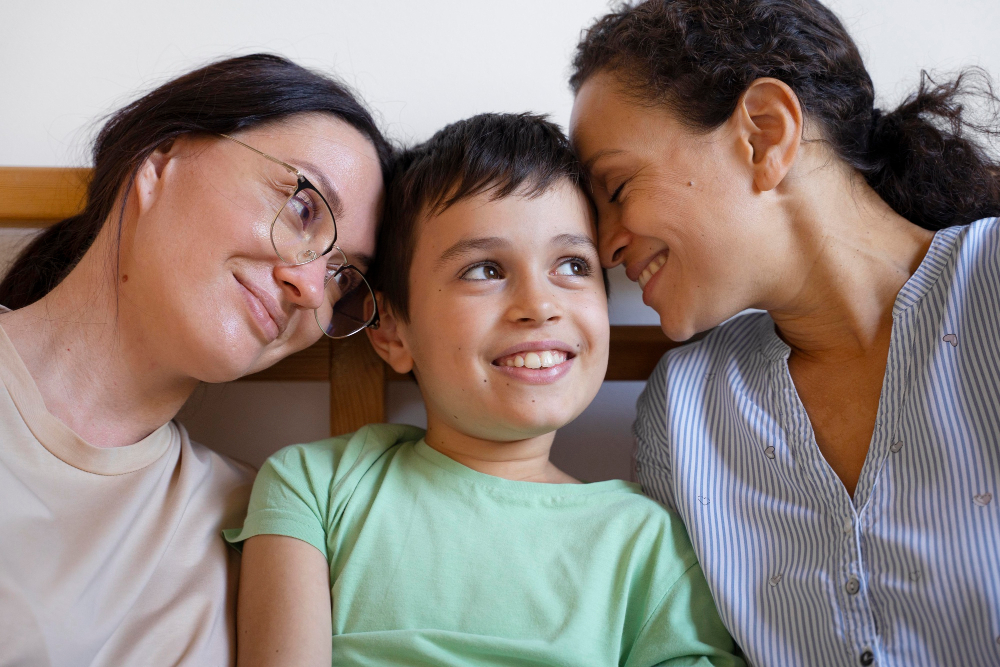 Same Sex Couple With Son Spending Time Together At Home