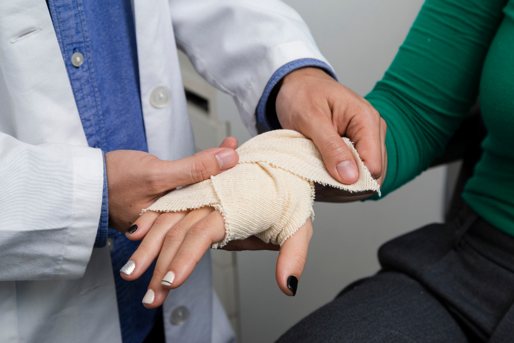 Close-Up-Of-Doctor-Bandaging-Hand